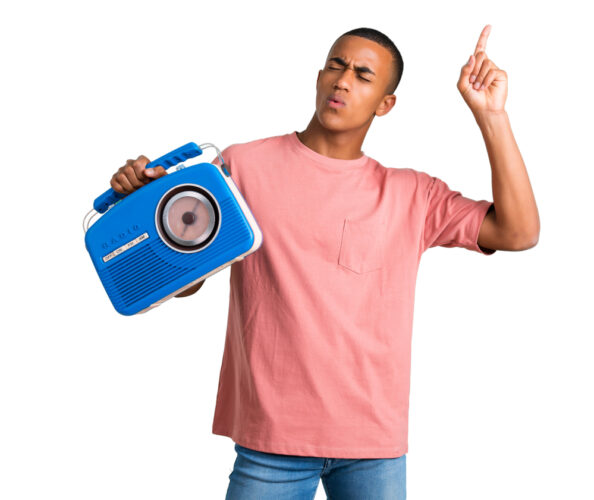 Young,African,American,Man,Holding,A,Blue,Vintage,Radio,While