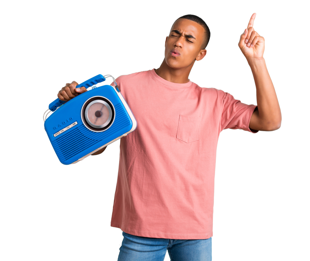 Young,African,American,Man,Holding,A,Blue,Vintage,Radio,While